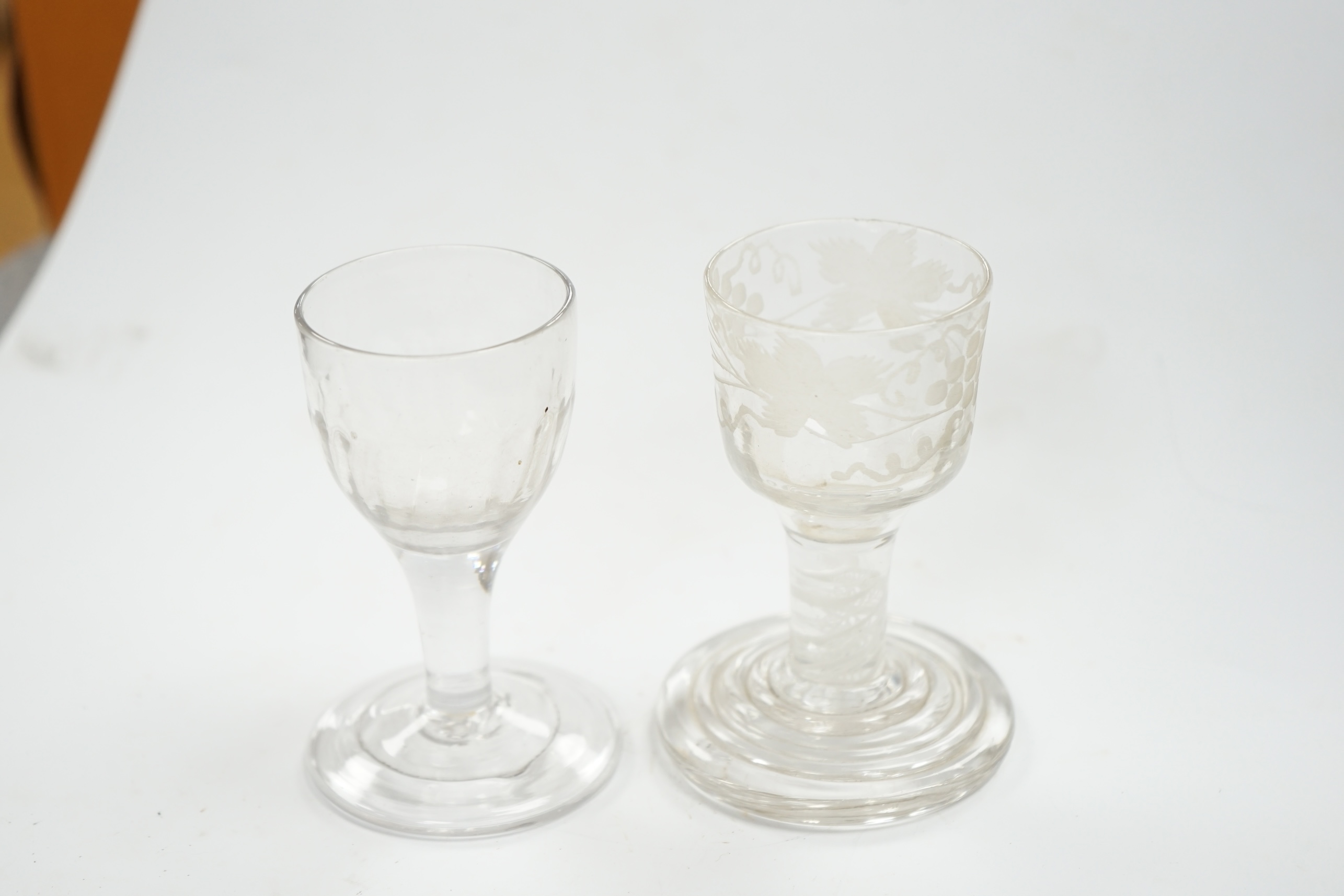 A mid 18th century firing glass with double series opaque twist stem and terraced foot, and another glass, tallest 9.5cm high. Condition - good